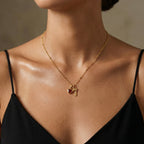 JUNE ELLE gold lucky number charm number 7 and a heart birthstone charm worn on model front view, customizable 0–9