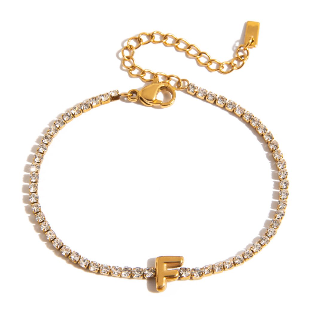 JUNE ELLE gold initial tennis bracelet with letter F arranged in a perfect circle on white background front view