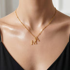 JUNE ELLE gold custom dual initial necklace worn alone front view on model