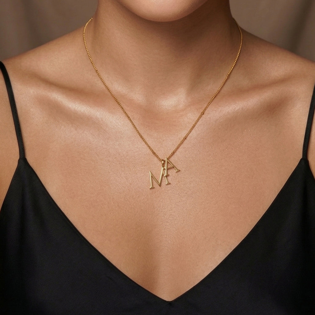 JUNE ELLE gold custom dual initial necklace in minimal styling worn alone on model front view