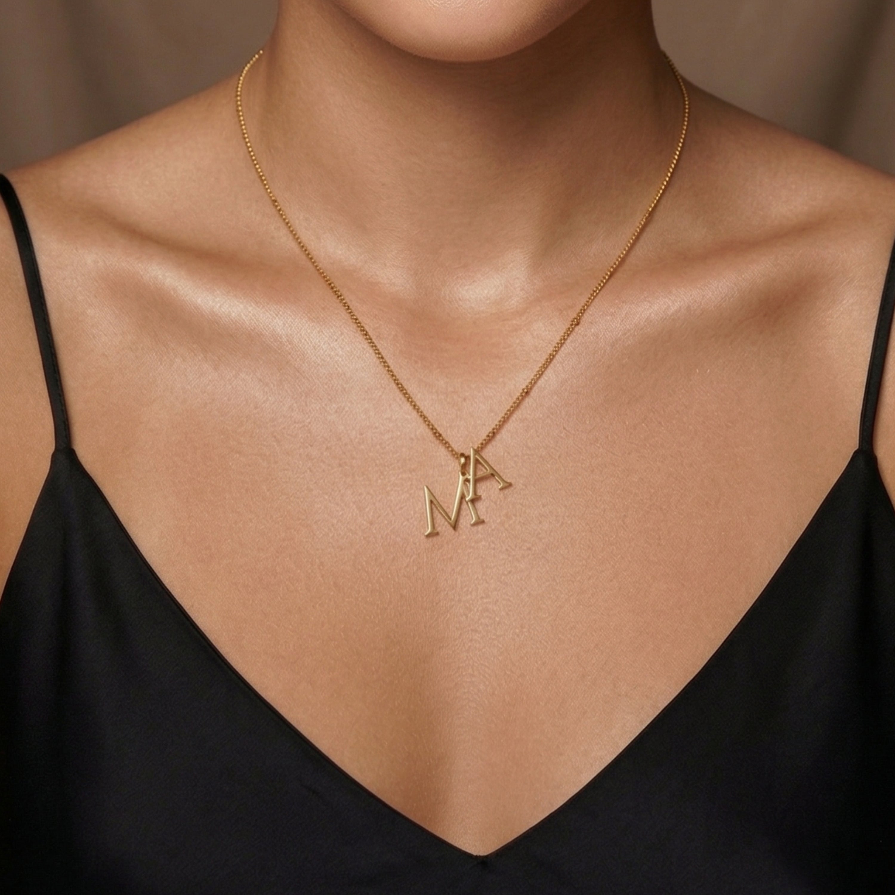 JUNE ELLE gold custom dual initial necklace in minimal styling worn alone on model front view