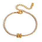 JUNE ELLE gold initial tennis bracelet with letter H arranged in a perfect circle on white background front view
