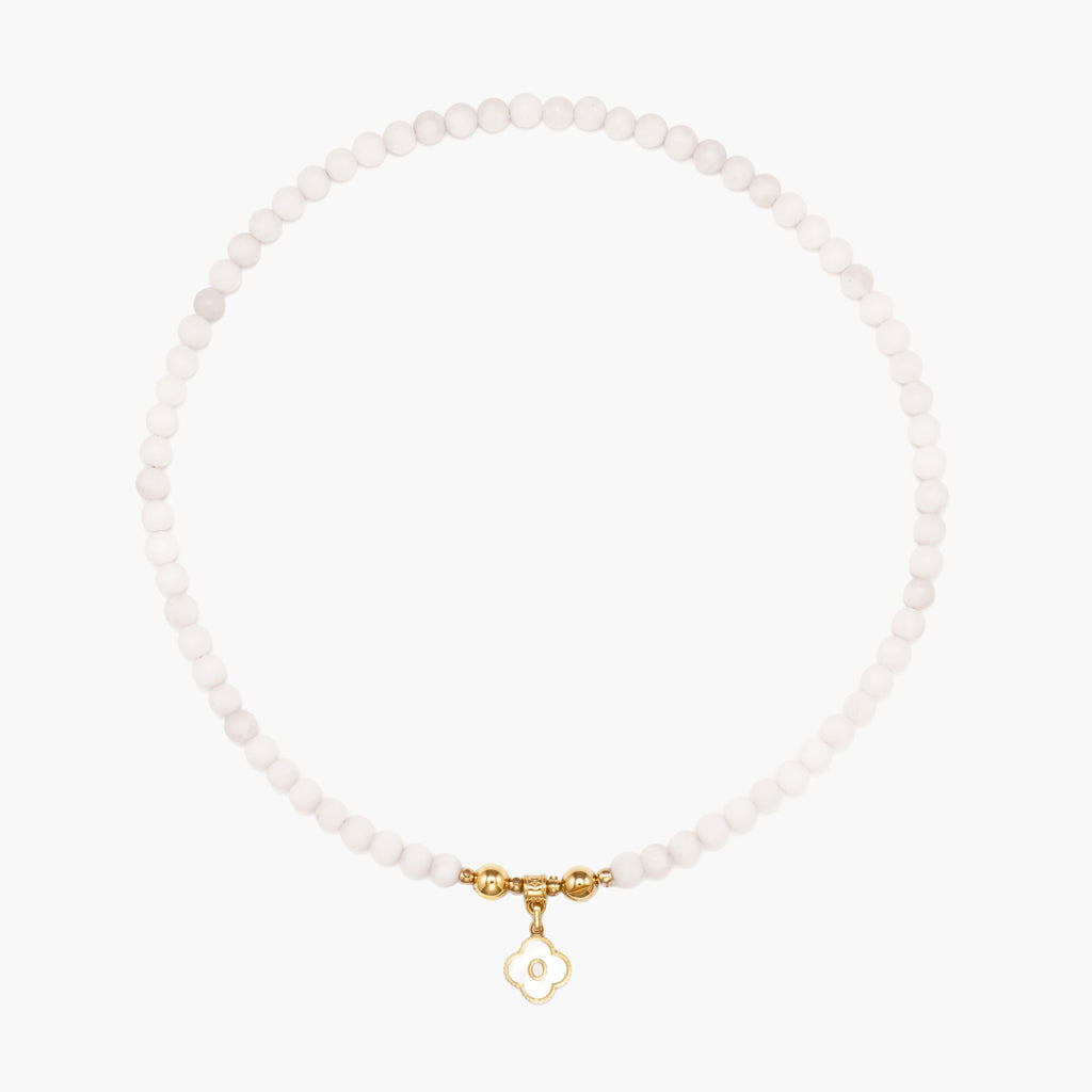 JUNE ELLE MagMix Rose Quartz Bead Necklace and a custom gold mother-of-pearl clover initial charm connected via a central gold magnetic clasp on a pure white background, showcasing modular combinations.