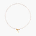 JUNE ELLE MagMix Rose Quartz Bead Necklace and a custom gold mother-of-pearl clover initial charm connected via a central gold magnetic clasp on a pure white background, showcasing modular combinations.