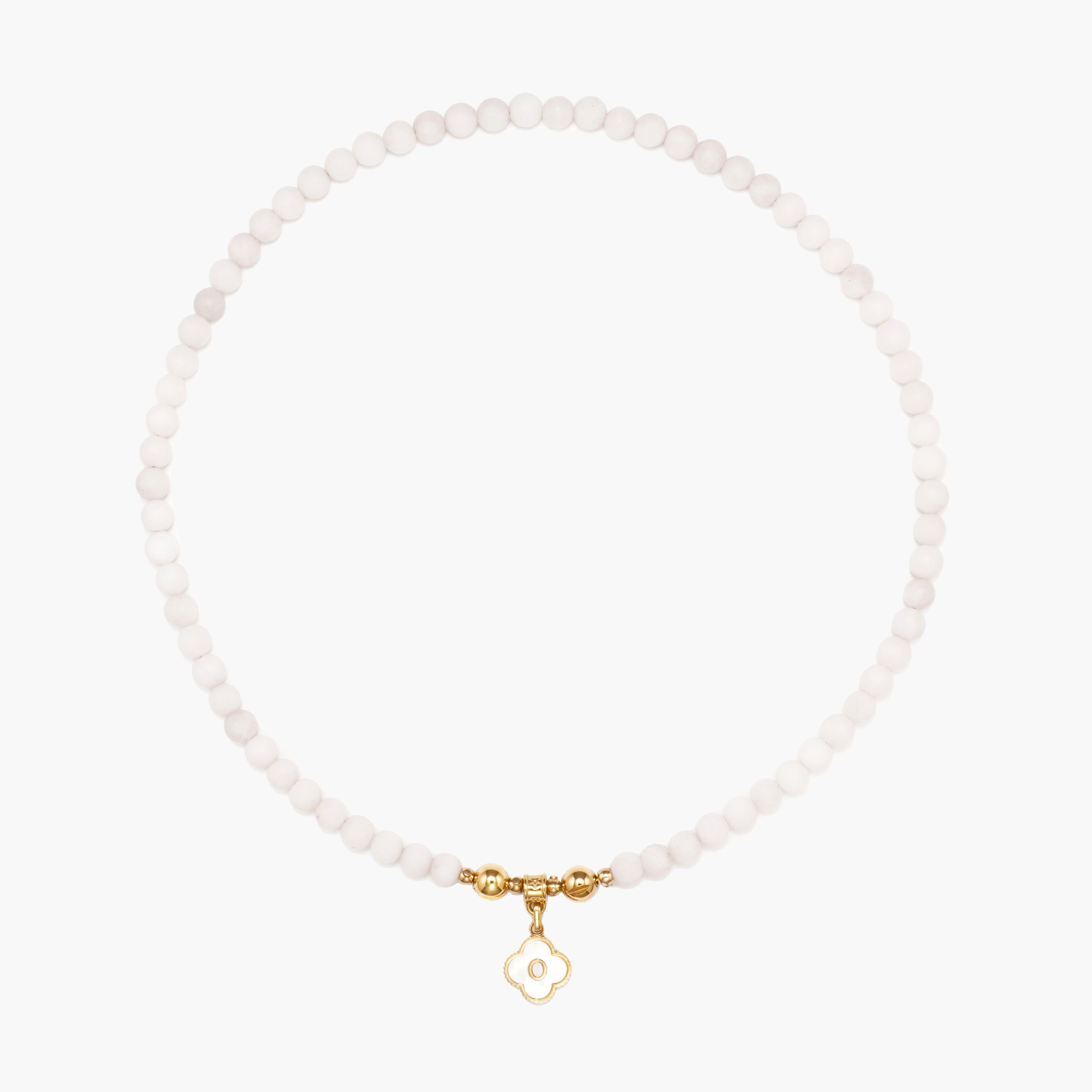 JUNE ELLE MagMix Rose Quartz Bead Necklace and a custom gold mother-of-pearl clover initial charm connected via a central gold magnetic clasp on a pure white background, showcasing modular combinations.