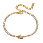 JUNE ELLE gold initial tennis bracelet with letter L arranged in a perfect circle on white background front view