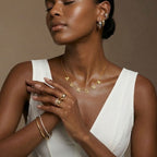JUNE ELLE gold custom letter name necklace spelling AURORA integrated into chain styled on model natural front view
