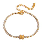 JUNE ELLE gold initial tennis bracelet with letter N arranged in a perfect circle on white background front view