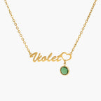 JUNE ELLE gold birthstone name necklace with Violet and a heart holding a round birthstone, name and heart integrated into chain front view on white background