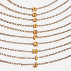 JUNE ELLE gold initial tennis bracelet featuring letters A to J close-up detail view on white background