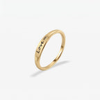 JUNE ELLE gold Lila engraved ring with LOVE infinity symbol as example engraving, customizable engraving, standing front view on white background