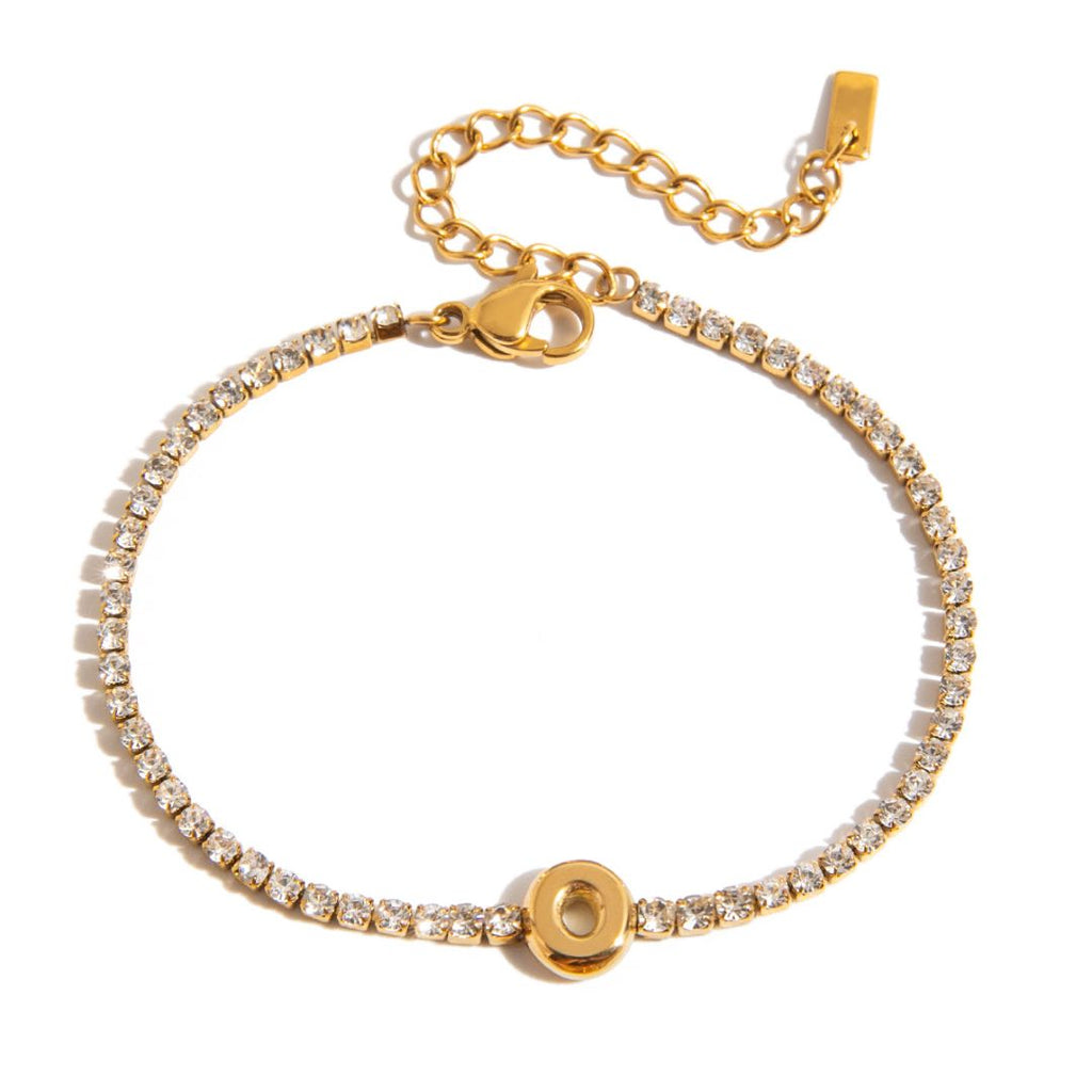JUNE ELLE gold initial tennis bracelet with letter O arranged in a perfect circle on white background front view