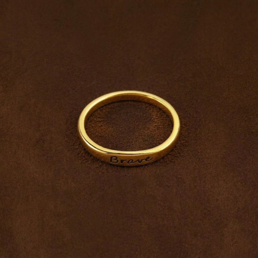 JUNE ELLE gold Lila engraved ring with LOVE infinity symbol as example engraving, customizable engraving, flat lay on brown fabric background