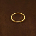 JUNE ELLE gold Lila engraved ring with LOVE infinity symbol as example engraving, customizable engraving, flat lay on brown fabric background