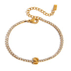 JUNE ELLE gold initial tennis bracelet with letter S arranged in a perfect circle on white background front view