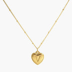 JUNE ELLE gold heart initial charm letter V on sphere chain necklace front view on white background
