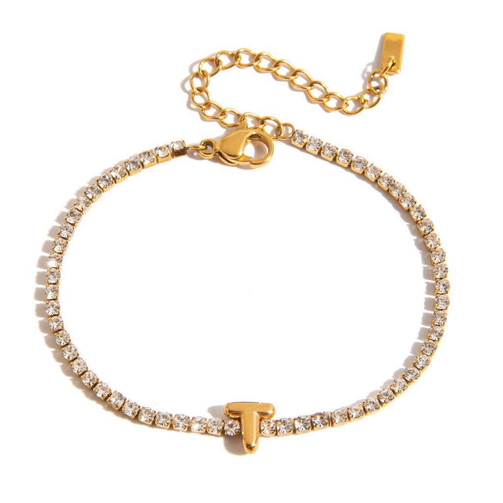 JUNE ELLE gold initial tennis bracelet with letter T arranged in a perfect circle on white background front view