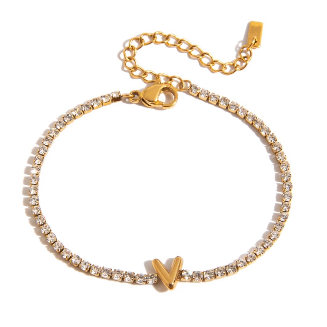 JUNE ELLE gold initial tennis bracelet with letter V arranged in a perfect circle on white background front view