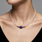 Model wearing the JUNE ELLE MagMix interchangeable necklace, combining a white chalcedony bead base chain with a lapis lazuli barrel centerpiece connected by gold magnetic clasps.
