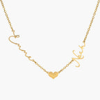 JUNE ELLE gold custom lovelink name necklace with Emma and Noah on each side of a heart link, names integrated into chain front view on white background