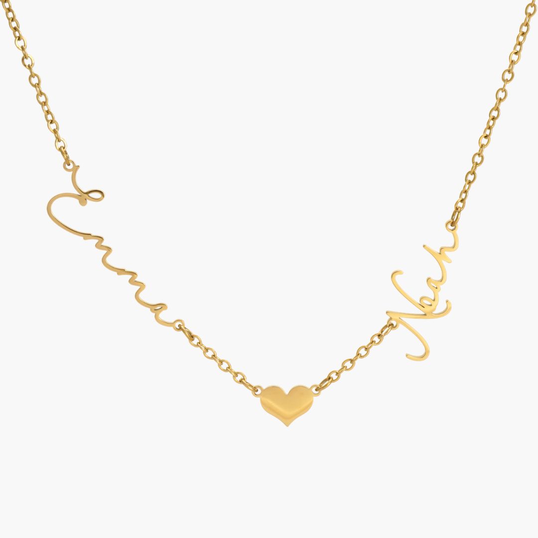 JUNE ELLE gold custom lovelink name necklace with Emma and Noah on each side of a heart link, names integrated into chain front view on white background