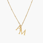 JUNE ELLE gold custom dual initial necklace featuring two initials front view on white background