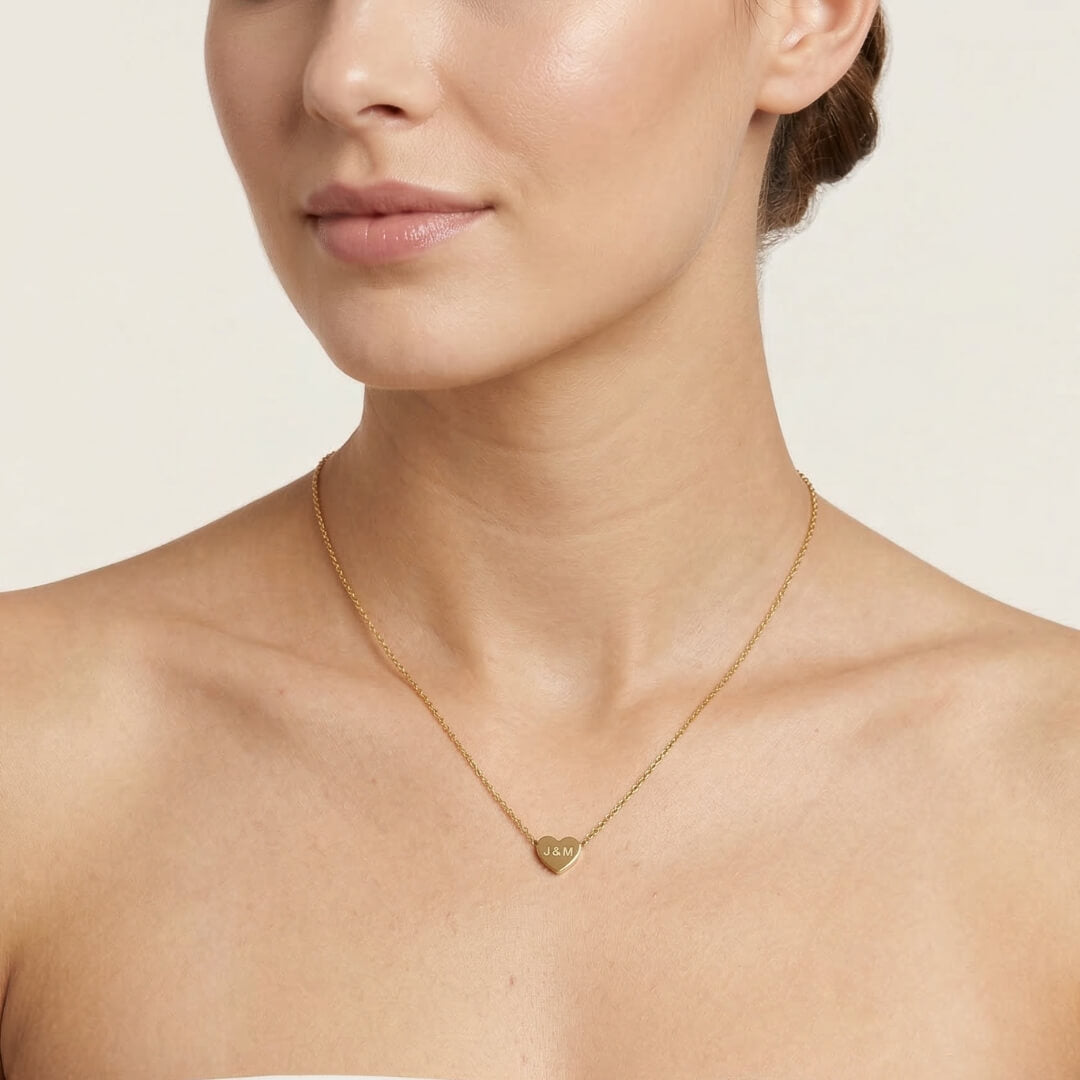 JUNE ELLE gold custom heart necklace engraved with J&M worn on model front view