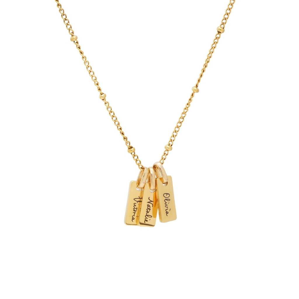 JUNE ELLE Gold Engraved Bar Necklace featuring three personalized nameplates, 'Victoria', 'Natalie', and 'Sophia', on a satellite chain.