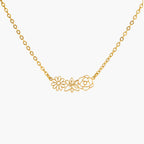 JUNE ELLE gold multiple birth flowers necklace with April Daisy, May Lily and June Rose integrated into chain front view on white background, customizable 1 to 5 flowers