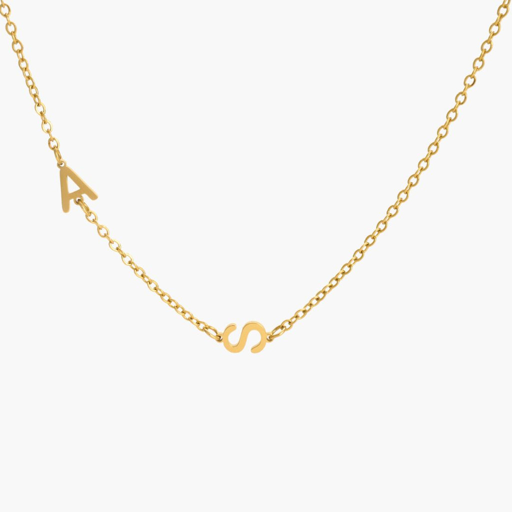 JUNE ELLE gold custom twin initial necklace with A and S integrated into chain front view on white background