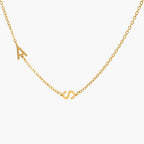 JUNE ELLE gold custom twin initial necklace with A and S integrated into chain front view on white background
