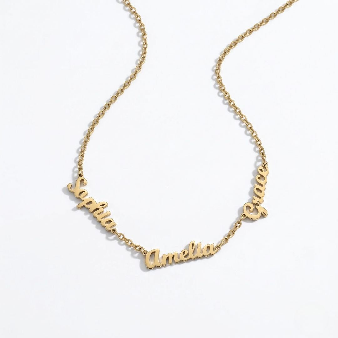 JUNE ELLE gold dainty custom multi name necklace with Sophia, Amelia and Grace as example names integrated into the chain side view on white background, customizable names