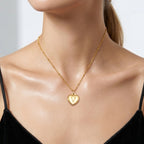 JUNE ELLE gold heart initial charm featuring letter V on sphere chain necklace worn on model front view, available in A to Z initials