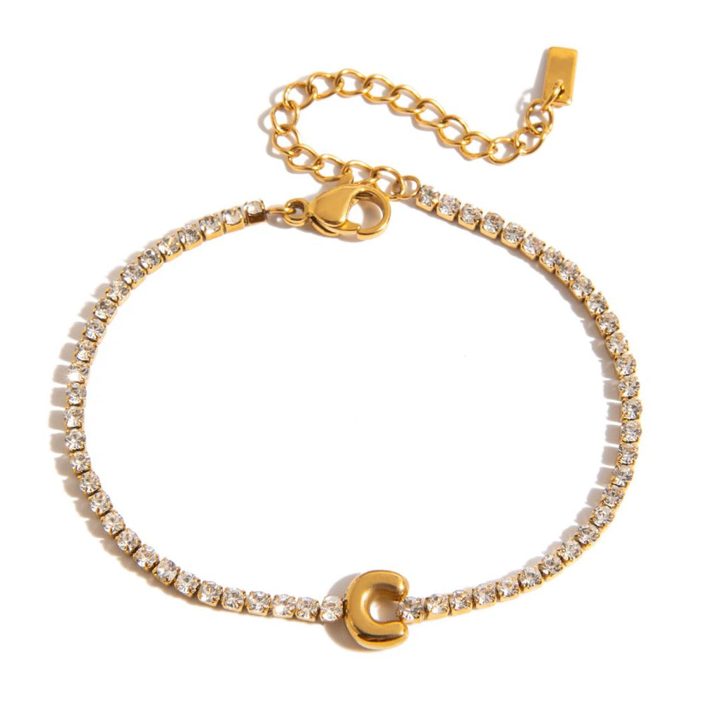 JUNE ELLE gold initial tennis bracelet with letter C arranged in a perfect circle on white background front view