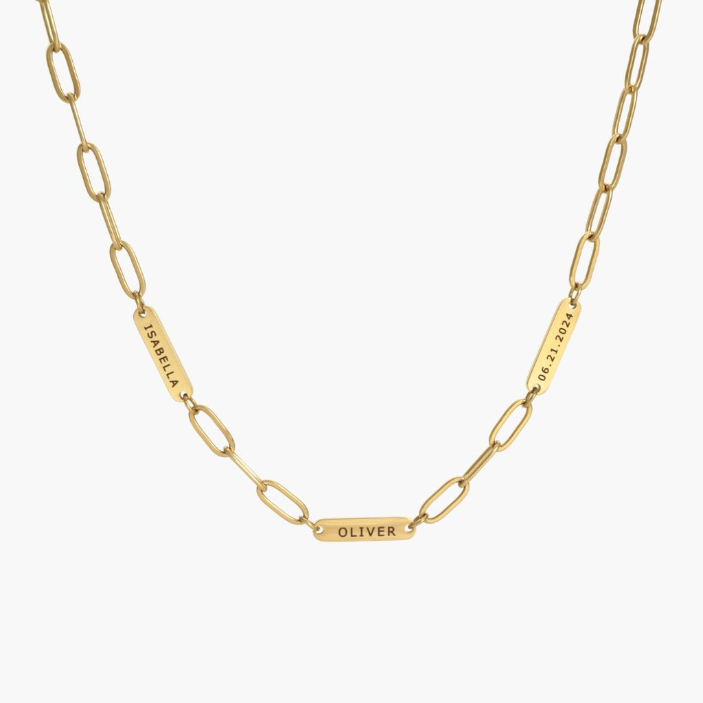 JUNE ELLE gold custom engraved tag necklace featuring Isabella, Oliver and 06.21.2024 on paperclip chain front view on white background