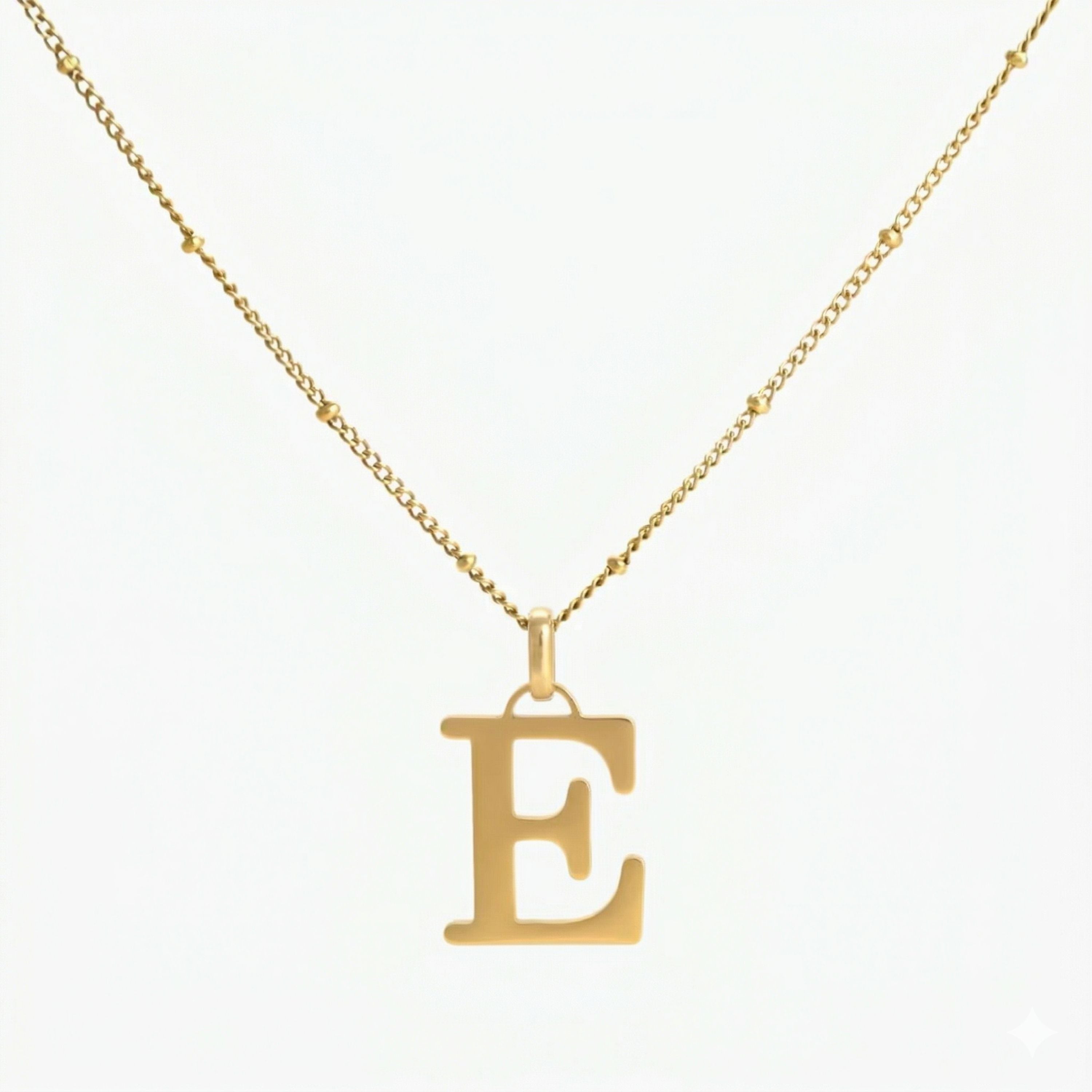 JUNE ELLE 18K gold plated stainless steel personalized E initial pendant necklace, custom letter jewelry shown in clear front view