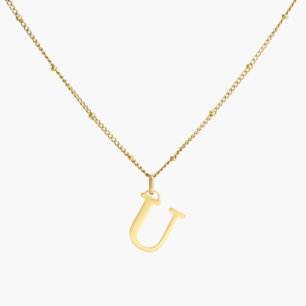 JUNE ELLE 18K gold plated stainless steel J initial pendant necklace, custom letter jewelry shown in clear front view