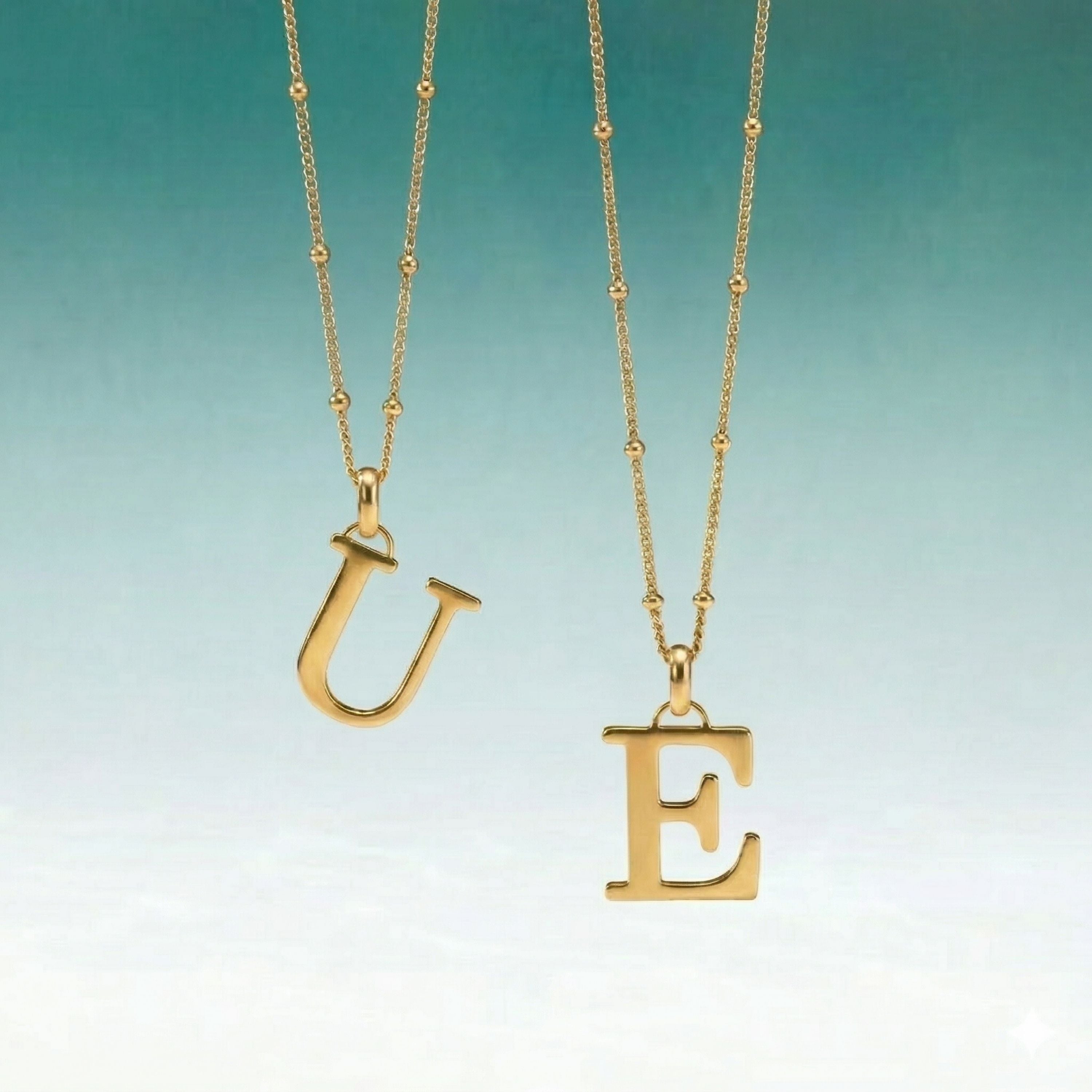 JUNE ELLE personalized 18K gold plated stainless steel initial pendant necklace with E and U letters, styled hanging scene