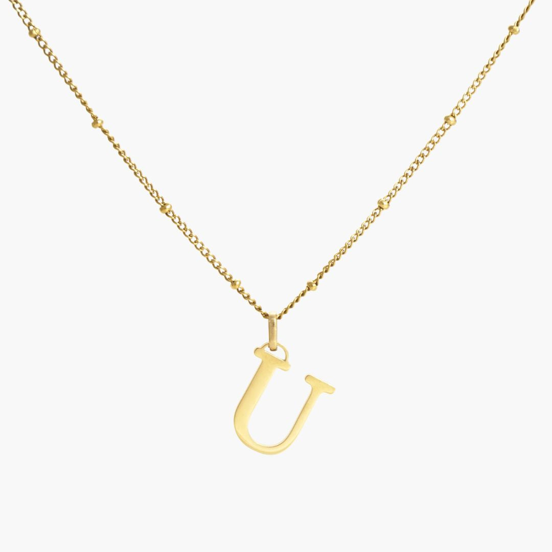 JUNE ELLE waterproof hypoallergenic 18K gold plated stainless steel U letter pendant necklace, clear front view