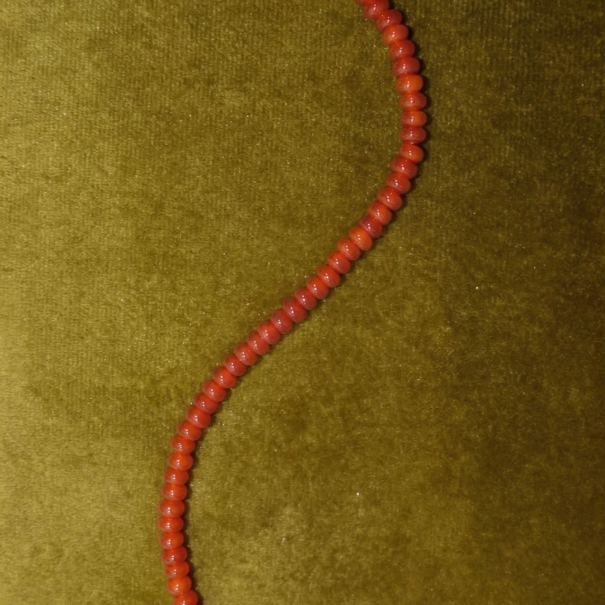 JUNE ELLE Natural Carnelian MagMix Bead Necklace close-up detail on green velvet background