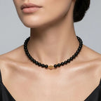 Model wearing the JUNE ELLE MagMix Obsidian Bead Chain Necklace with a front-facing gold magnetic clasp.