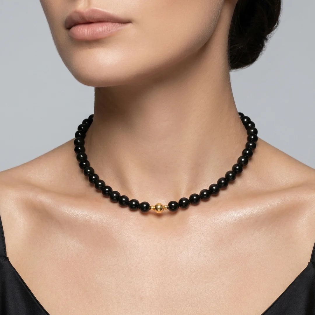 Model wearing the JUNE ELLE MagMix Obsidian Bead Chain Necklace with a front-facing gold magnetic clasp.