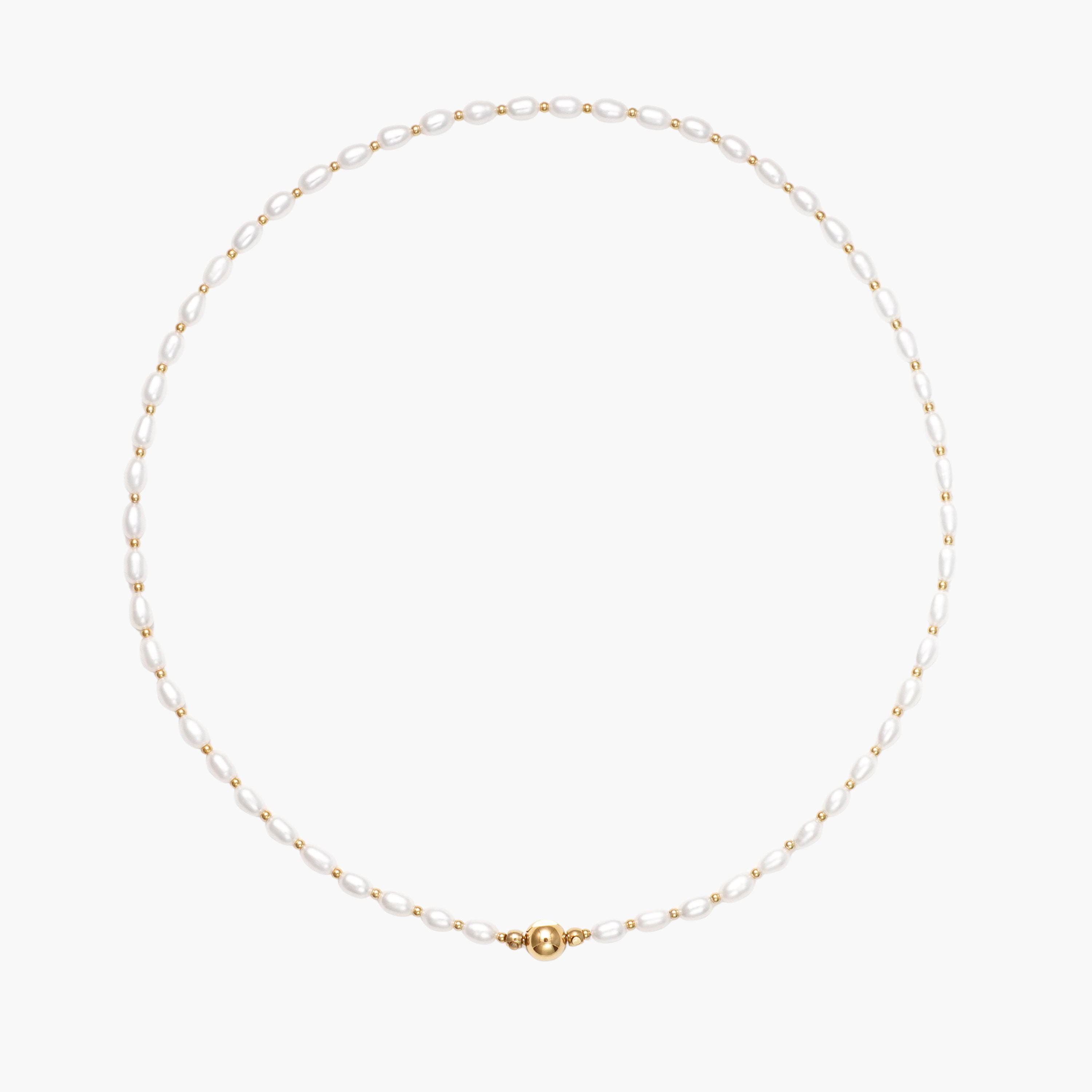 JUNE ELLE MagMix Seed Pearl and Gold Spacer Bead Necklace with a central gold magnetic clasp on a pure white background, allowing for modular combinations with other MagMix pieces.