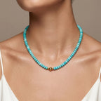 Model wearing the JUNE ELLE MagMix Turquoise Bead Chain Necklace with a front-facing gold magnetic clasp.