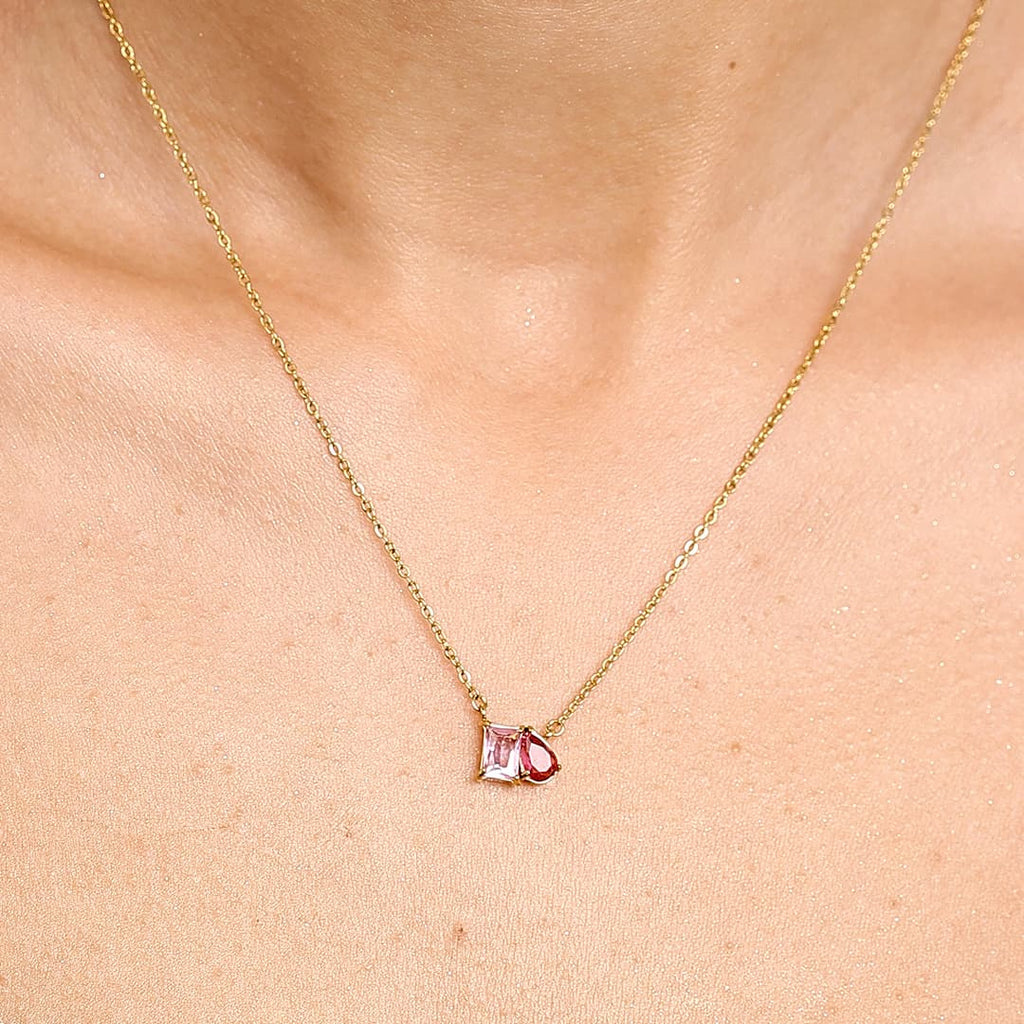 Collarbone view of a custom waterproof 18K gold PVD Toi et Moi necklace with pink birthstones